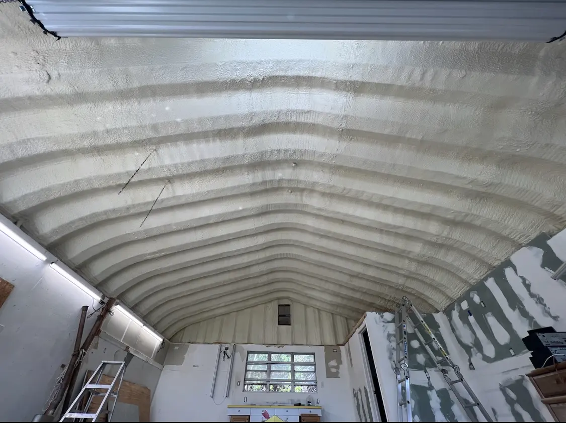 Spray polyurethane foam applied to the underside of a metal roof deck in Summerville